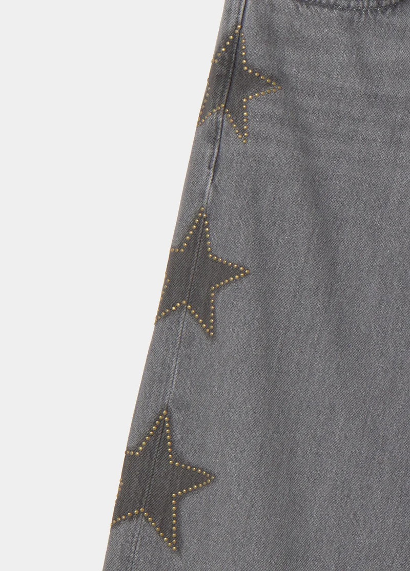 Jeans with stars and side studs