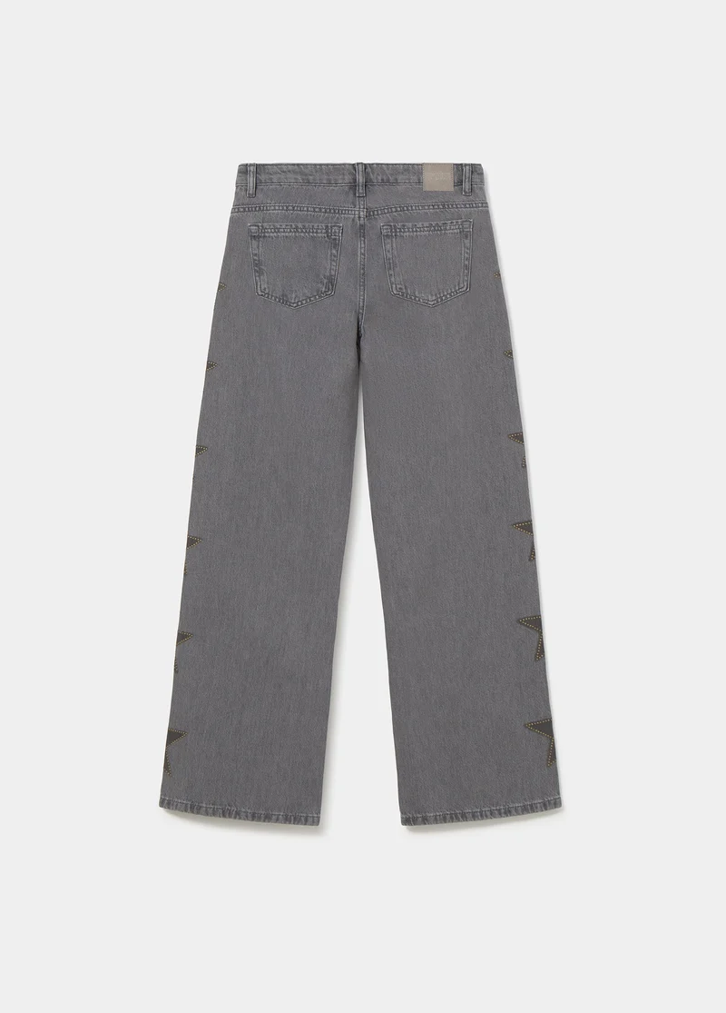 Jeans with stars and side studs