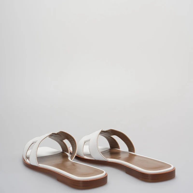 Hermes Oran Flats Sandalen aus weißem Leder, Größe 36